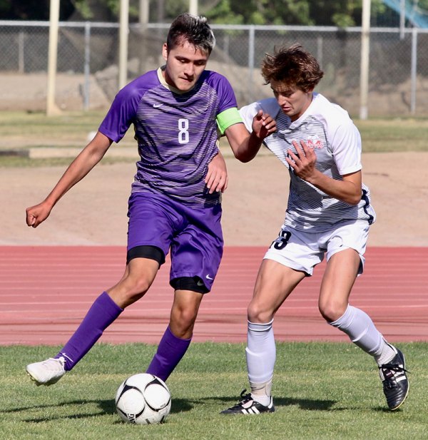 Lemoore's varsity boys' soccer edged in CIF Quarterfinals in Division 3 playoff action Thursday night in Tiger Stadium Lemoore's Jadon Silvestre scored the Tigers only goal in the second half of Thursday's CIF soccer playoff match in Lemoore. The Tigers lost 2-1 in a close contest.